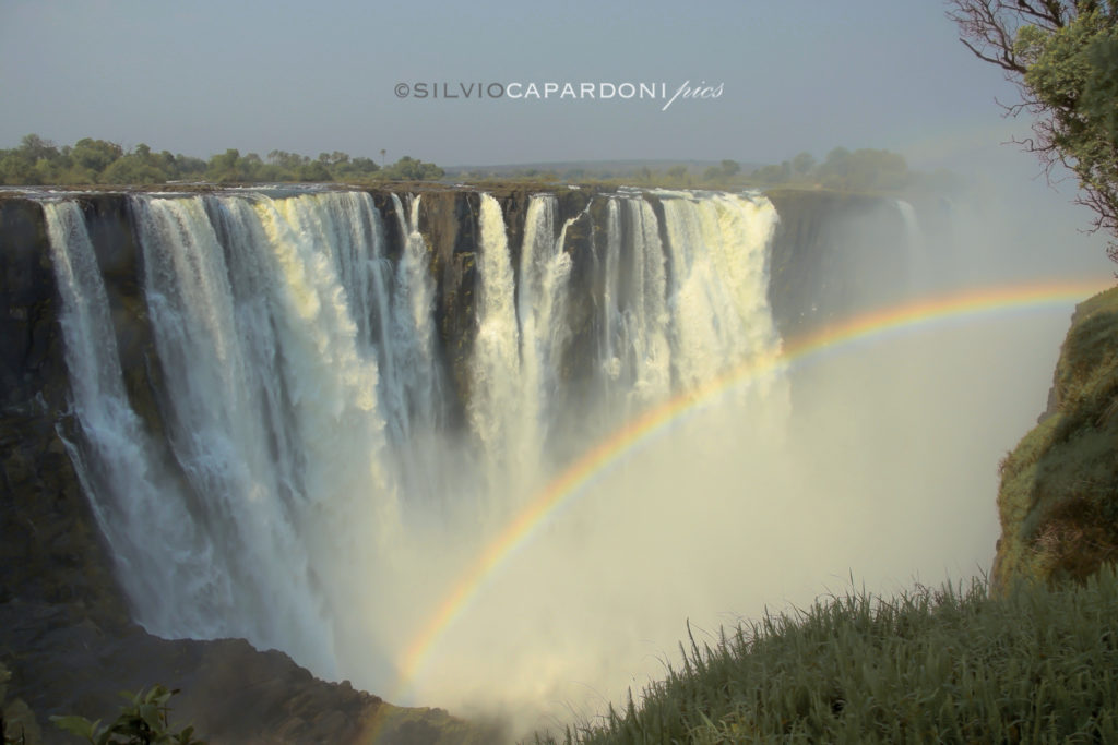 Landscape of Mosi oa Tunya better known as Victoria Falls with rainbow, Victoria Falls, Zimbabwe